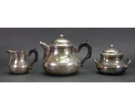 A French electroplated three piece tea service, first half 20th century, of baluster form with blackwood scroll handles, a ci