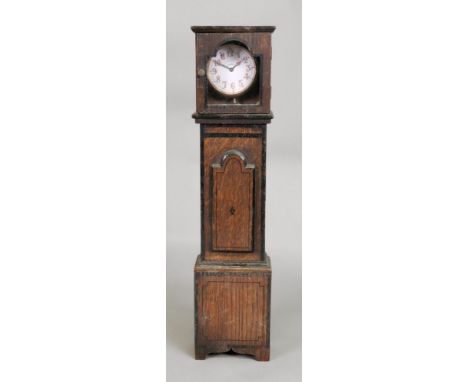 A miniature reproduction George III style oak longcase clock, with ebonised bandings, containing an 8 day timepiece in gilt m