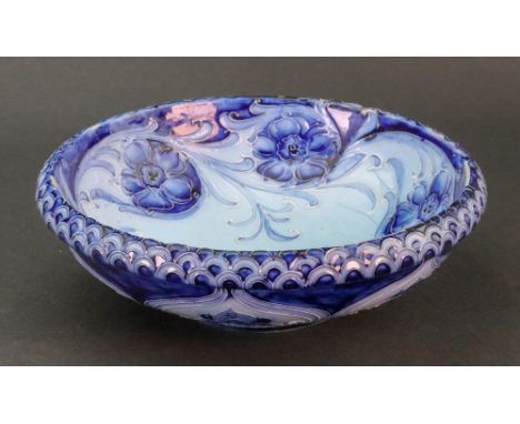 A Moorcroft Florian Ware shallow circular bowl, on a spreading rim foot, M. 1561, Rd No. 360570, 6cm high x 18cm wide.Illustr