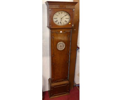 An early 20th century geometric moulded oak longcase clock, having a silvered oval dial, the door inset with aneroid baromete