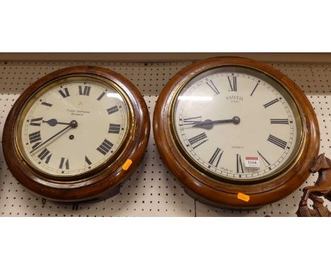 A stained walnut cased circular wall clock, the dial signed Smith Enfield London, dial dia.12"; together with a stained beech