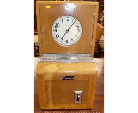 A mid-20th century blond oak clocking-in and clocking-out clock by Gensign, w.36cm