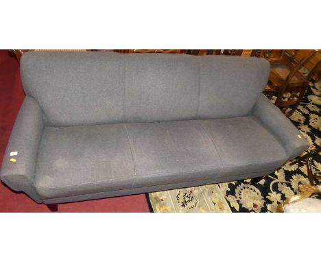 A contemporary grey cloth fabric upholstered three-seater sofa, raised on ebonised square tapering supports, width 190cm