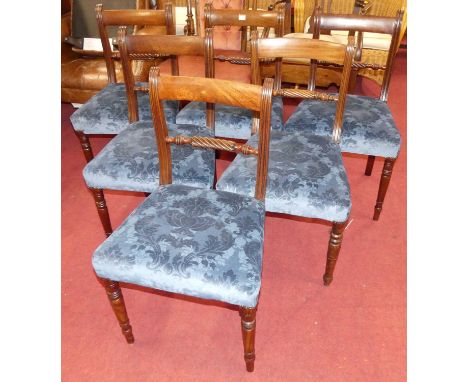 A set of six 19th century mahogany bar back dining chairs, having rope twist central support and blue floral upholstered stuf