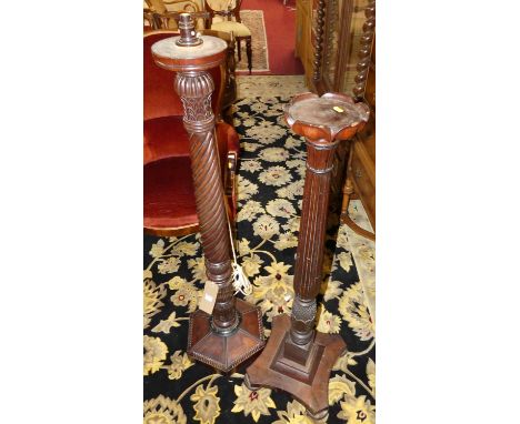 A spiral turned mahogany standard lamp; together with a similar dish topped torchere stand (2)