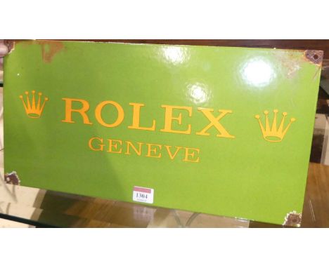 An enamel on metal wall mounted sign bearing text 'Rolex Geneve', 23 x 46cm