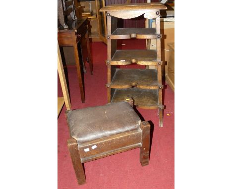 An Arts &amp; Crafts oak four-tier open shelf, of unusual form; together with an early 20th century oak footstool (2)Stool wi