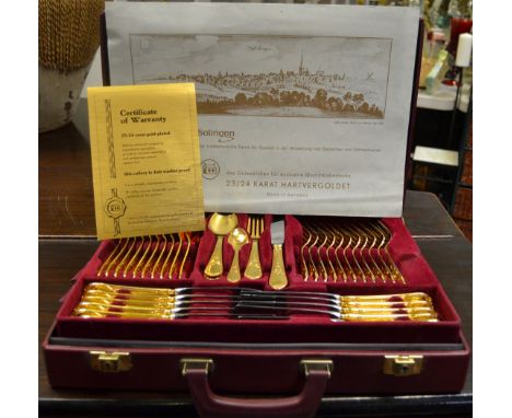 A Solingen of W Germany 23-24 carat gold-plated canteen of cutlery for twelve settings including knives, forks, spoons, soup 