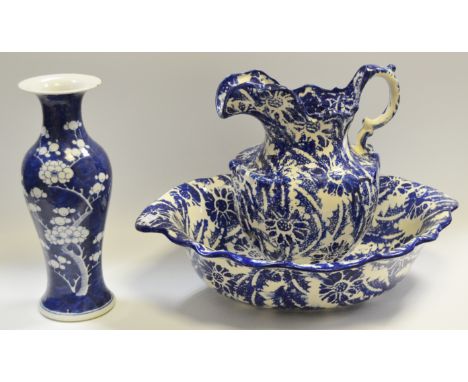 A Victorian style blue and white jug and basin, late 20th Century; a Chinese prunus blue and white slender baluster vase (3)