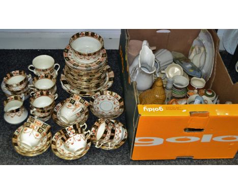 A Staffordshire tea service, printed with floral swags, decorated with alternating panels, in black and rust, c.1900;   decor