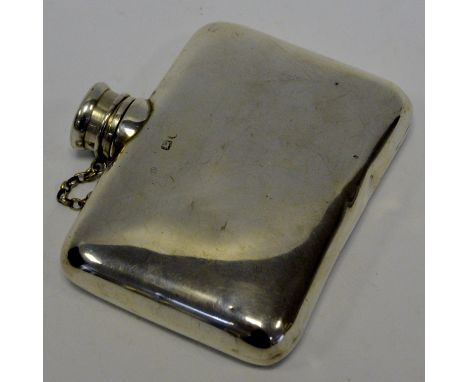 *** Please note amended description ***  A silver oblong hip flask, screw top with safely chain, indistinct marks