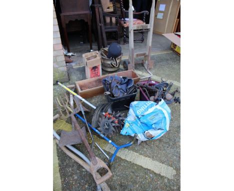 Collection of tools, to include long handled tools, scarifier, wooden sack barrow, clamps, spanners, two lamps, wooden trough