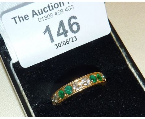 Diamond and emerald eternity ring. Approx. UK size M-N and weight 3.4g