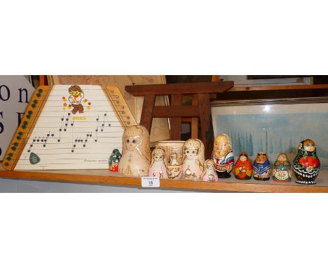 A Russian child's toy zither, some painted wooden Russian matryoshkadolls and a painted pine tuck box