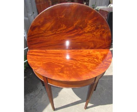Geo. III mahogany tea table, demi-lune folding top on twin gate action fluted supports with spade feet,  H92cm W90cm D64cm 