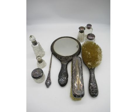 Hallmarked Sterling silver dressing table set of two brushes, a Hallmarked Sterling silver hand mirror, a Hallmarked Sterling