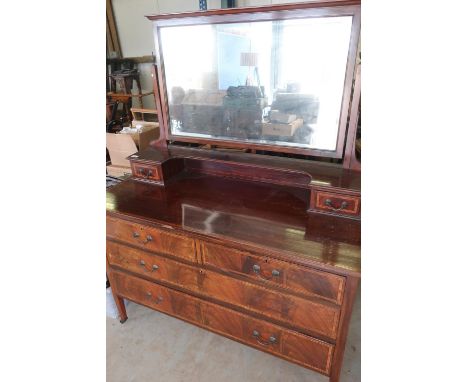 Edwardian inlaid mahogany dressing chest with bevelled edged mirror and two drawers above two short and two long drawers, on 