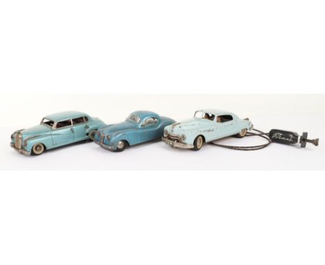 Three tinplate Motor cars, German 1950s, JNF Mercedes in metallic blue (spring broken) 9 ½” (24cm) long, fair condition, Dist