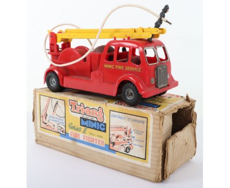 Boxed Tri-ang Minic Series 2 Fire Fighter Fire engine, red plastic body with friction drive motor, tinplate grill, bell and y