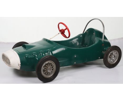 A Tri-ang moulded plastic child’s pedal Racing car, English circa 1970, finished in British racing green with white nose cone