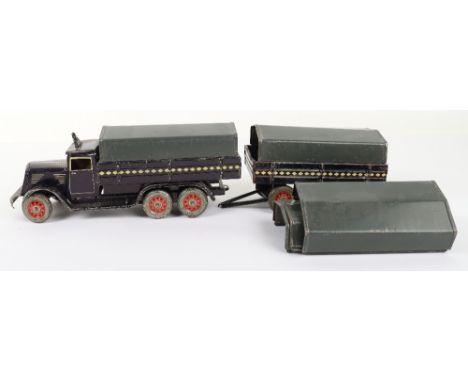 Tippco clockwork six-wheel truck and trailer, German 1930s, finished in dark blue with yellow details, Dunlop Cord wheels and