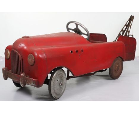 A scarce Tri-ang Commercial pressed steel child’s pedal Tow Truck, English 1950s, red painted body, replaced cast steering wh