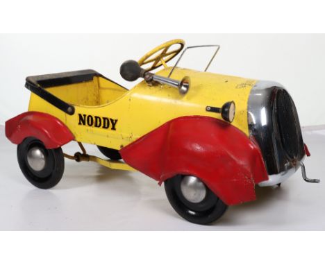 A Tri-ang pressed steel Noddy child’s pedal car, English 1960s, finished in yellow, chrome grill with dummy starting handle a