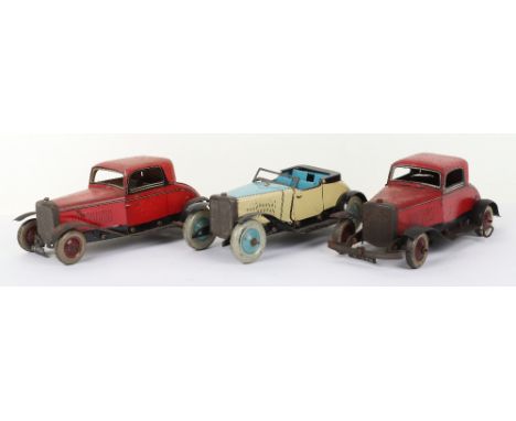 Three Ubilda clockwork tinplate Motor Cars, Burnett Ltd cream and light blue open tourer, number plate 17-025, good working c