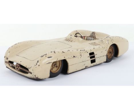 Friction driven tinplate Mercedes Racing car, Western Germany 1950s, finished in cream with single seat and steering wheel, 1