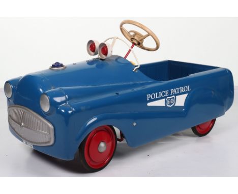 A Mobo pressed steel Police Patrol child’s pedal car, English 1960s, finished in blue with white plastic steering wheel, orig