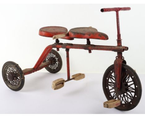 Tri-ang child’s scarce tandem tricycle, circa 1940, finished in red with spoked wheels and rubber tyres, fair used condition.