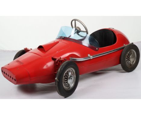 A Tri-ang pressed steel Vanwall child’s pedal Racing car, English 1960s, finished in racing red, replacement cast steering wh