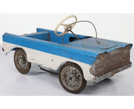 A Tri-ang pressed steel T45C Miami child’s pedal car, English released 1965, painted in blue and white, with padded seat and 