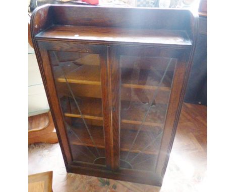 OAK BOOKCASE. Vintage oak bookcase with three shelves and twin glazed doors, A/F, H ~ 122cm