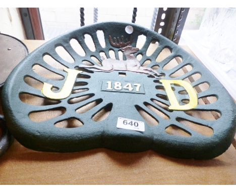 CAST IRON. Cast iron John Deere tractor seat, D ~ 30cm