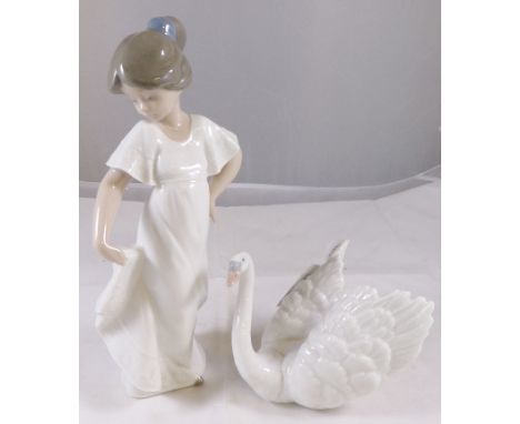 LLADRO SWAN AND NAO LADY. Lladro figurine of a swan marked D256 to underside and a Nao lady figurine, H ~ 22cm