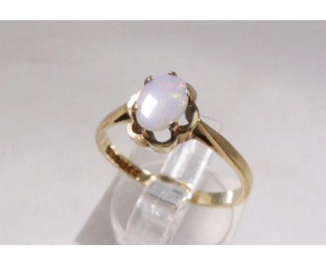 9CT AND OPAL RING. 9ct gold and opal ring, size P