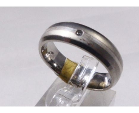 WEDDING RING. Titanium and silver wedding ring with diamond