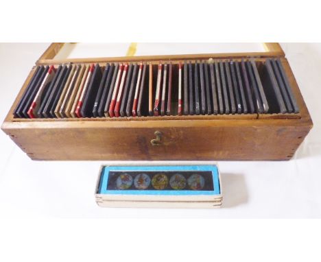 MAGIC LANTERN SLIDES. Two boxes of antique magic lantern slides including Royal Geographical and childrens examples