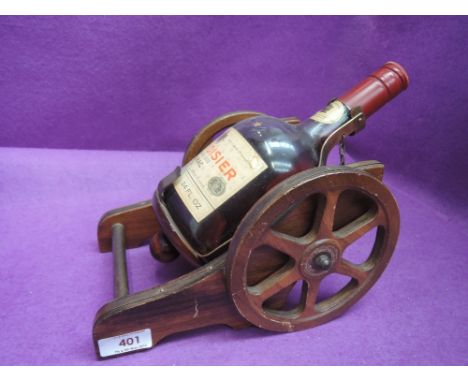 An early 1950's bottle of Courvoisier Three Star Luxe Cognac 70% proof 24fl oz, modelled as a cannon, By Appointment To The L