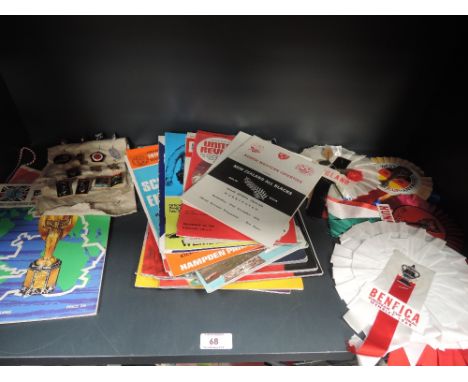 A shelf of 1960's and later football, rugby and Olympic memorabilia including Jules Rimet Cup England 1966 souvenir programme