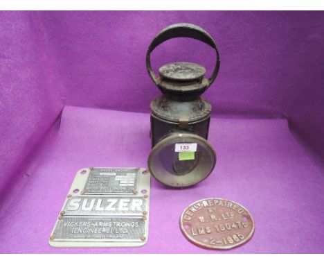 A vintage LMS carriage lamp and wagon plate along with a Sulzer engine plate  
