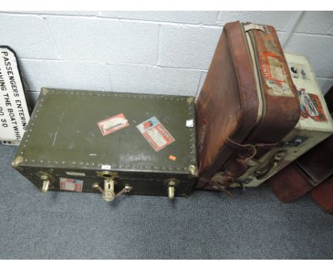 A selection of early 20th century travel trunk suitcase and luggage bearing many transport and travel badges including Cunard