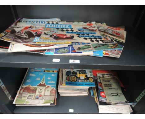 Two shelves of 1960's and later Diecast catalogues, magazines and similar ephemera including Britains 1965, 1967, 1977, Dinky