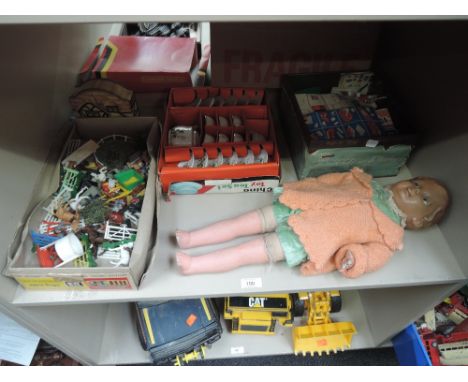 A shelf of mixed toys, BetaBuild pieces, Britains plastic farm animals and accessories, Childs Toy Tea Set and a doll