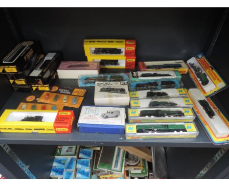 A large collection over six shelves of Graham Farish, Hornby, Peco, Lima, Gem and similar N gauge Locomotives, Rolling Stock,