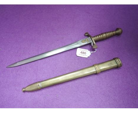 A German brass and metal dagger with scabbard, Fuhrer Fabrick Kraupp 1943 and swastika plus Eagle on blade and scabbard, blad