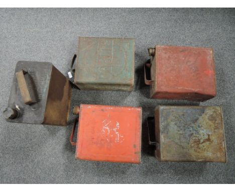 A selection of motoring oil and similar fuel cans including Pratts and Redline with original caps
