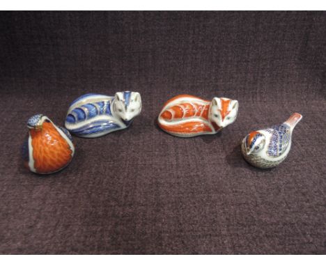 Four Royal Crown Derby paperweights, Red Fox, Robin and Wren all having silver gilt stoppers and Artic Fox having ceramic sto