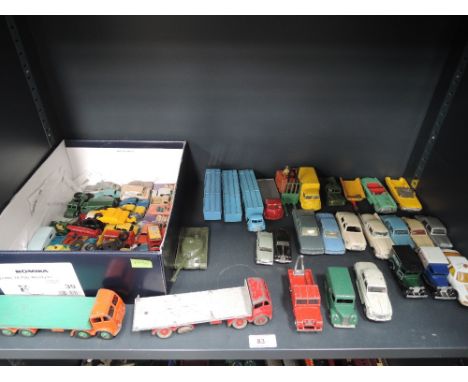 A shelf of playworn Dinky, Corgi, Lesney and similar diecasts including two Dinky Foden flatbeds, Ford Zephyr, Chivers Jellie